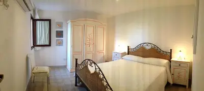 Letto o letti in una camera di Sardegna Beach Cala Reale