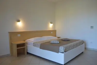 Letto o letti in una camera di Guest Rooms Affittacamere