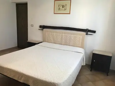 Letto o letti in una camera di Villa Sa Curcurica