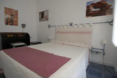 Letto o letti in una camera di Nughe 'e' Oro Guesthouse