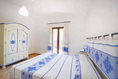 Letto o letti in una camera di Le Case di Maiorca CAV - PMS CaseVacanze