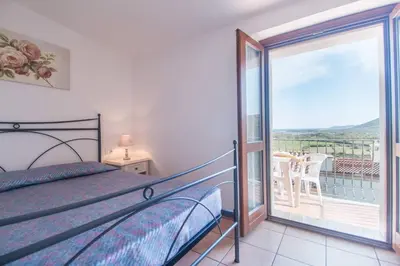 Letto o letti in una camera di Casa Angelina-Ammentos Posada
