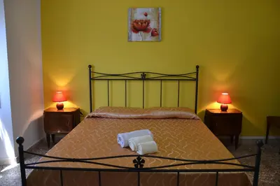 Letto o letti in una camera di Casa indipendente immersa nel verde con vista mare
