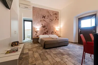 Letto o letti in una camera di Karama