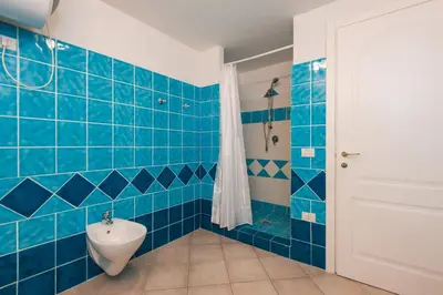 Bagno di Apartment in S'Abba e Sa Pedra complex with pool