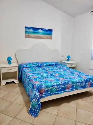 Letto o letti in una camera di Appartamento La Caletta 500m dal mare