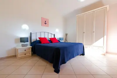 Letto o letti in una camera di Residence SardegnaSummer Li Mori