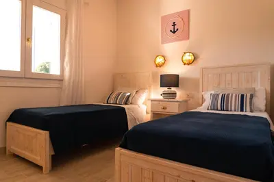 Letto o letti in una camera di Residence SardegnaSummer Li Mori