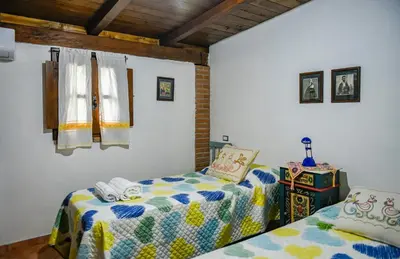 Letto o letti in una camera di Villa Cusidore