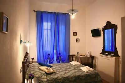 Letto o letti in una camera di b&b Duca d'Aosta