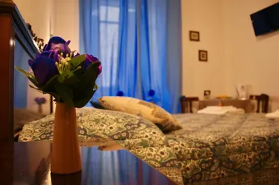 Letto o letti in una camera di b&b Duca d'Aosta