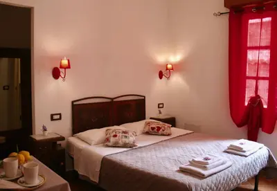 Letto o letti in una camera di b&b Duca d'Aosta