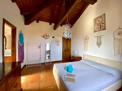 Letto o letti in una camera di Villa Acchiappasogni