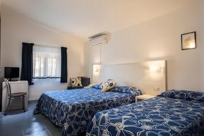 Letto o letti in una camera di Hotel La Playa
