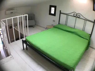 Letto o letti in una camera di Villaggio Tamerici IUN Q7142