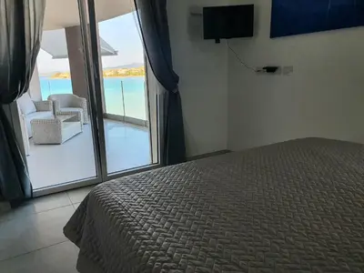 Letto o letti in una camera di Appartamento delfini sul mare