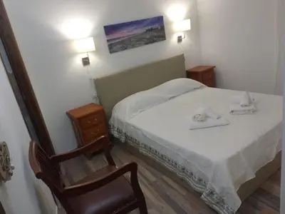 Letto o letti in una camera di B&B LE ISOLE