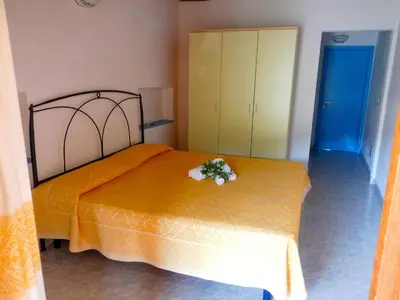 Letto o letti in una camera di Residence La Pineta