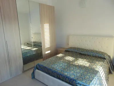 Letto o letti in una camera di Villetta La Caletta