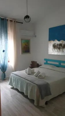 Letto o letti in una camera di B&B Cala Luna