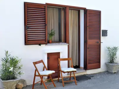 Balcone o terrazza di Bilocale al piano terra a 3 minuti dal mare a La Caletta