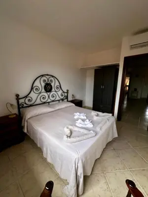 Letto o letti in una camera di Amazing Suite Olbia
