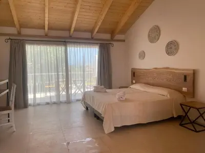 Letto o letti in una camera di Hotel Le Mimose