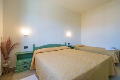 Letto o letti in una camera di Residenza Gli Ontani