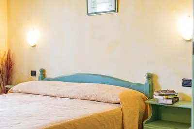 Letto o letti in una camera di Residenza Gli Ontani