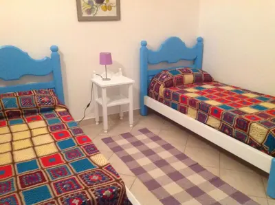 Letto o letti in una camera di casa la caletta