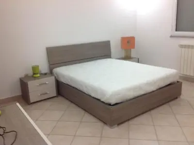Letto o letti in una camera di casa la caletta