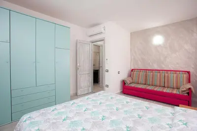 Letto o letti in una camera di Residence La Cinta