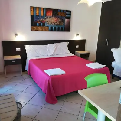Letto o letti in una camera di La Locanda Del Mare -Domo- Affittacamere