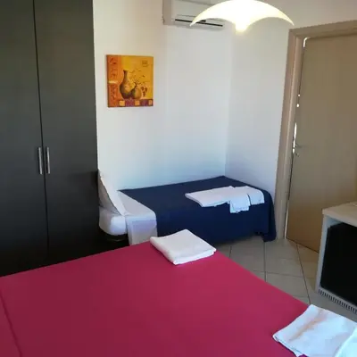 Letto o letti in una camera di La Locanda Del Mare -Domo- Affittacamere