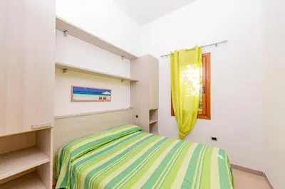 Letto o letti in una camera di Centro Residenziale Le Canne