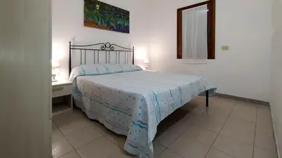 Letto o letti in una camera di Centro Residenziale Le Canne