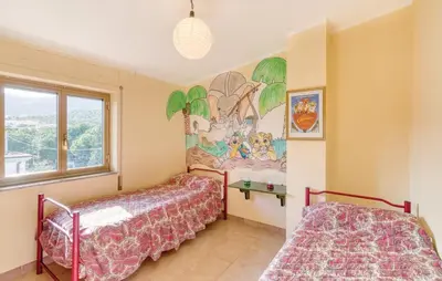 Letto o letti in una camera di Appartamenti Camilla e Gabriele Cala Gonone