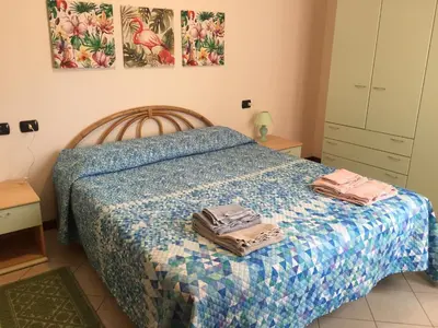 Letto o letti in una camera di Via Acquedotto n. 66, Condominio 