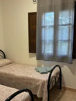 Letto o letti in una camera di Sardegna Pittulongu