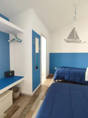 Letto o letti in una camera di B&B Fradama' Holiday