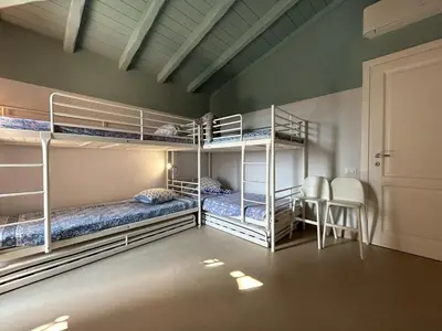 Letto o letti in una camera di Casa Giumagio