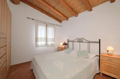 Letto o letti in una camera di Villa Isuledda Beach