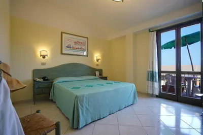Letto o letti in una camera di Nicolaus Club Torre Moresca