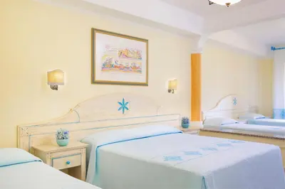 Letto o letti in una camera di Club Hotel Marina Beach