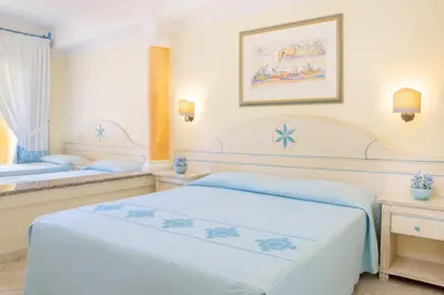 Letto o letti in una camera di Club Hotel Marina Beach