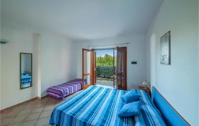 Letto o letti in una camera di Amazing Apartment In San Teodoro Ot