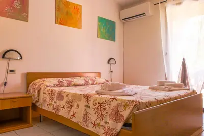 Letto o letti in una camera di Residence Oasi Anfiteatro
