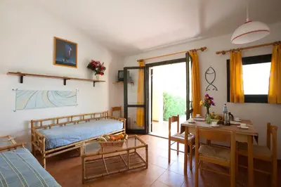 Letto o letti in una camera di Residence Baia Salinedda