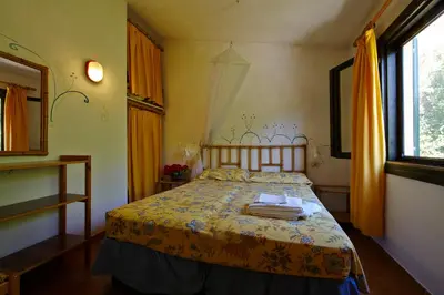 Letto o letti in una camera di Residence Baia Salinedda