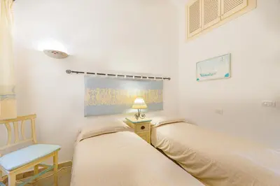 Letto o letti in una camera di Villa con vista Porto San Paolo